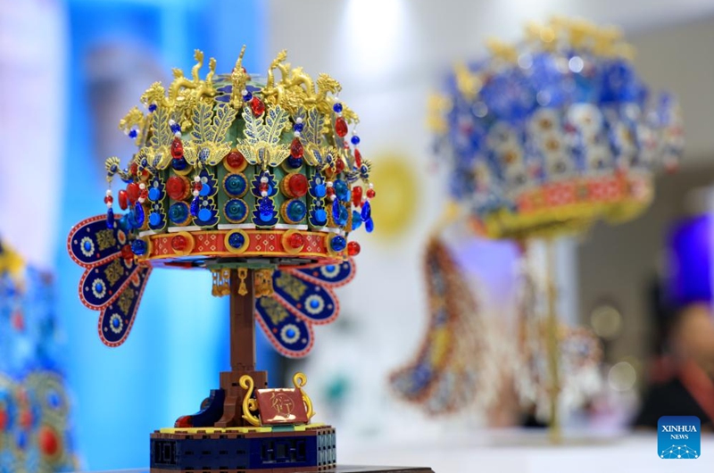 This photo taken on May 22, 2026 shows an assembly model replicating a delicate empress crown from the Ming dynasty (1368-1644) at the 22nd China (Shenzhen) International Cultural Industries Fair in Shenzhen, south China's Guangdong Province.
The 22nd China (Shenzhen) International Cultural Industries Fair kicked off here on Thursday, showcasing over 120,000 cultural products. The Creative China exhibition area brings together domestic cultural IPs, sci-tech innovation products, cultural and tourism products, intangible cultural heritage products, and popular creative cultural products. Creative cultural products from more than 30 famous domestic cultural heritage institutions and museums are also showcased during the event, attracting numerous visitors. Photo: Xinhua