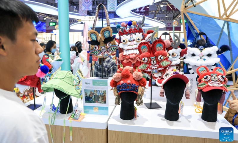 A visitor learns about creative cultural products at the booth of Guangxi Zhuang Autonomous Region during the 22nd China (Shenzhen) International Cultural Industries Fair in Shenzhen, south China's Guangdong Province, May 22, 2026.
The 22nd China (Shenzhen) International Cultural Industries Fair kicked off here on Thursday, showcasing over 120,000 cultural products. The Creative China exhibition area brings together domestic cultural IPs, sci-tech innovation products, cultural and tourism products, intangible cultural heritage products, and popular creative cultural products. Creative cultural products from more than 30 famous domestic cultural heritage institutions and museums are also showcased during the event, attracting numerous visitors. Photo: Xinhua