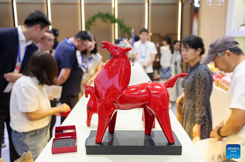Visitors select creative cultural products at the 22nd China (Shenzhen) International Cultural Industries Fair in Shenzhen, south China's Guangdong Province, May 22, 2026.
The 22nd China (Shenzhen) International Cultural Industries Fair kicked off here on Thursday, showcasing over 120,000 cultural products. The Creative China exhibition area brings together domestic cultural IPs, sci-tech innovation products, cultural and tourism products, intangible cultural heritage products, and popular creative cultural products. Creative cultural products from more than 30 famous domestic cultural heritage institutions and museums are also showcased during the event, attracting numerous visitors. Photo: Xinhua